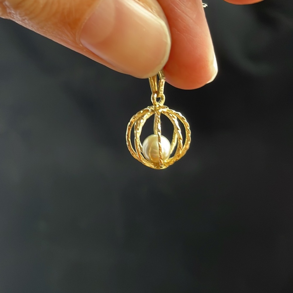 Black Pearl in golden globe pendant necklace